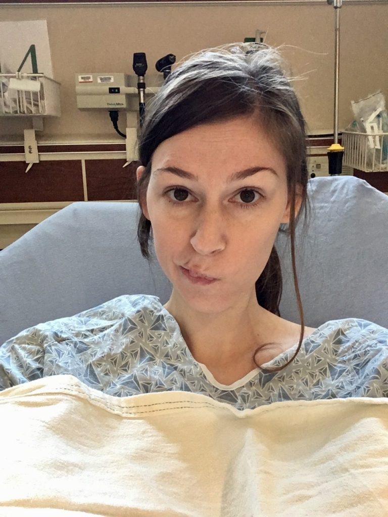Jenna half-smiling in hospital bed