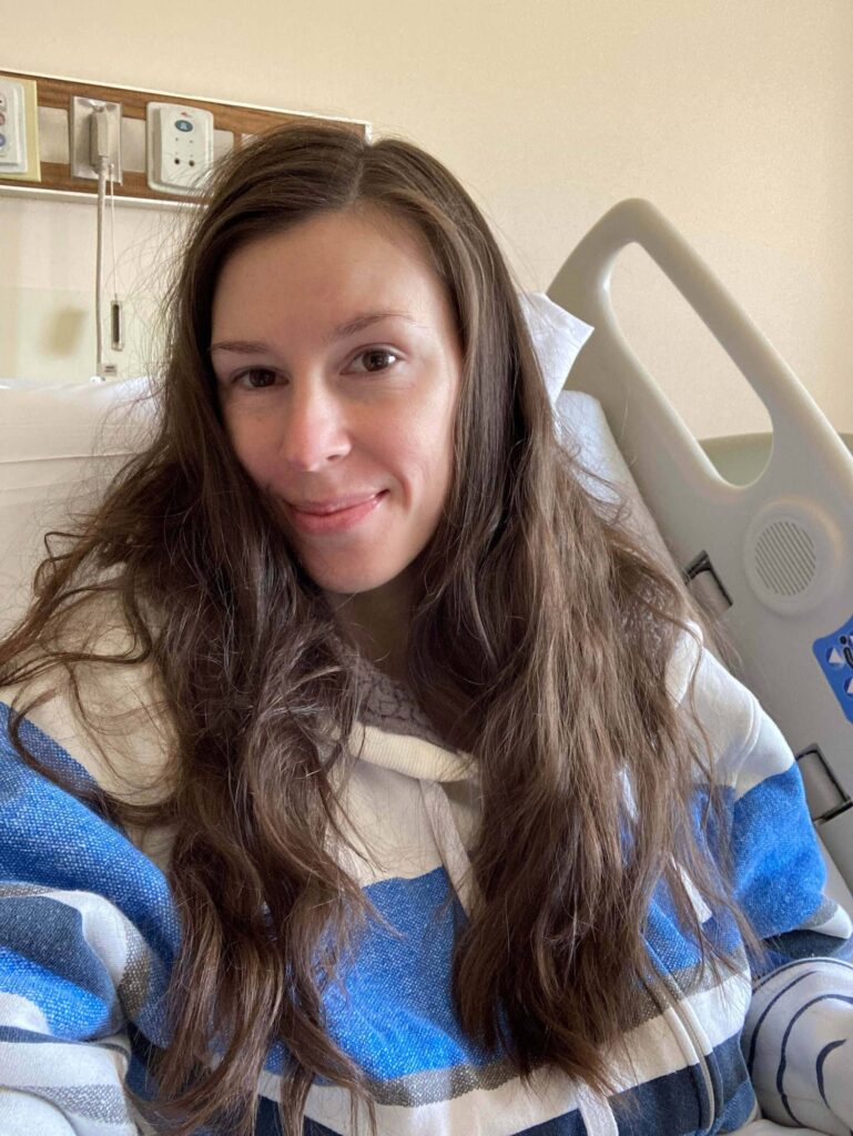 Jenna smiling from hospital bed