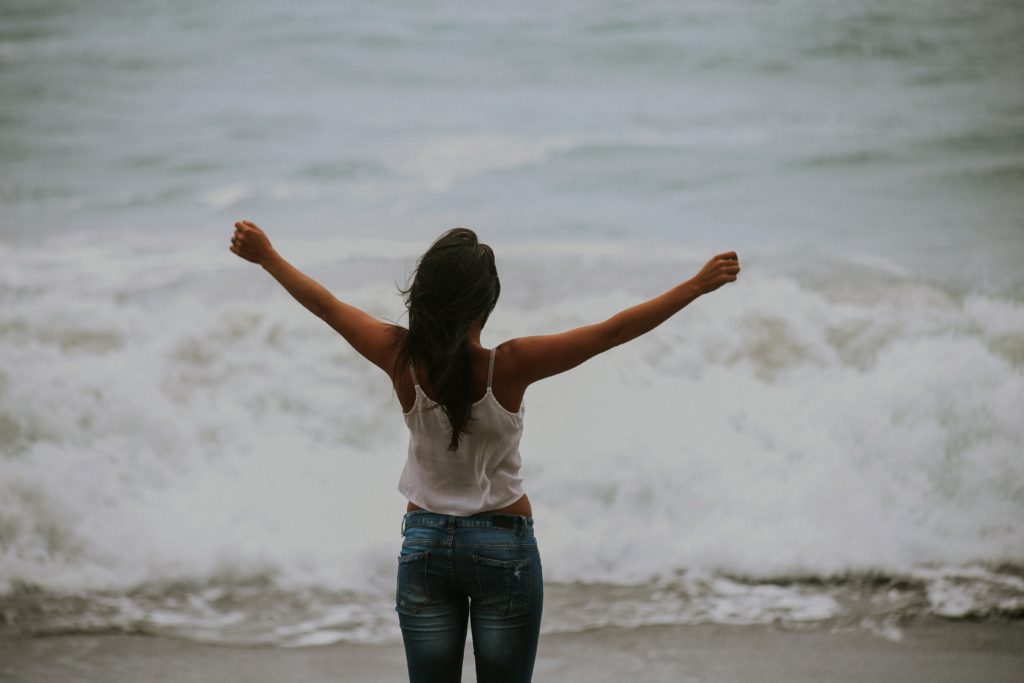 PSC patient looking happy by the ocean