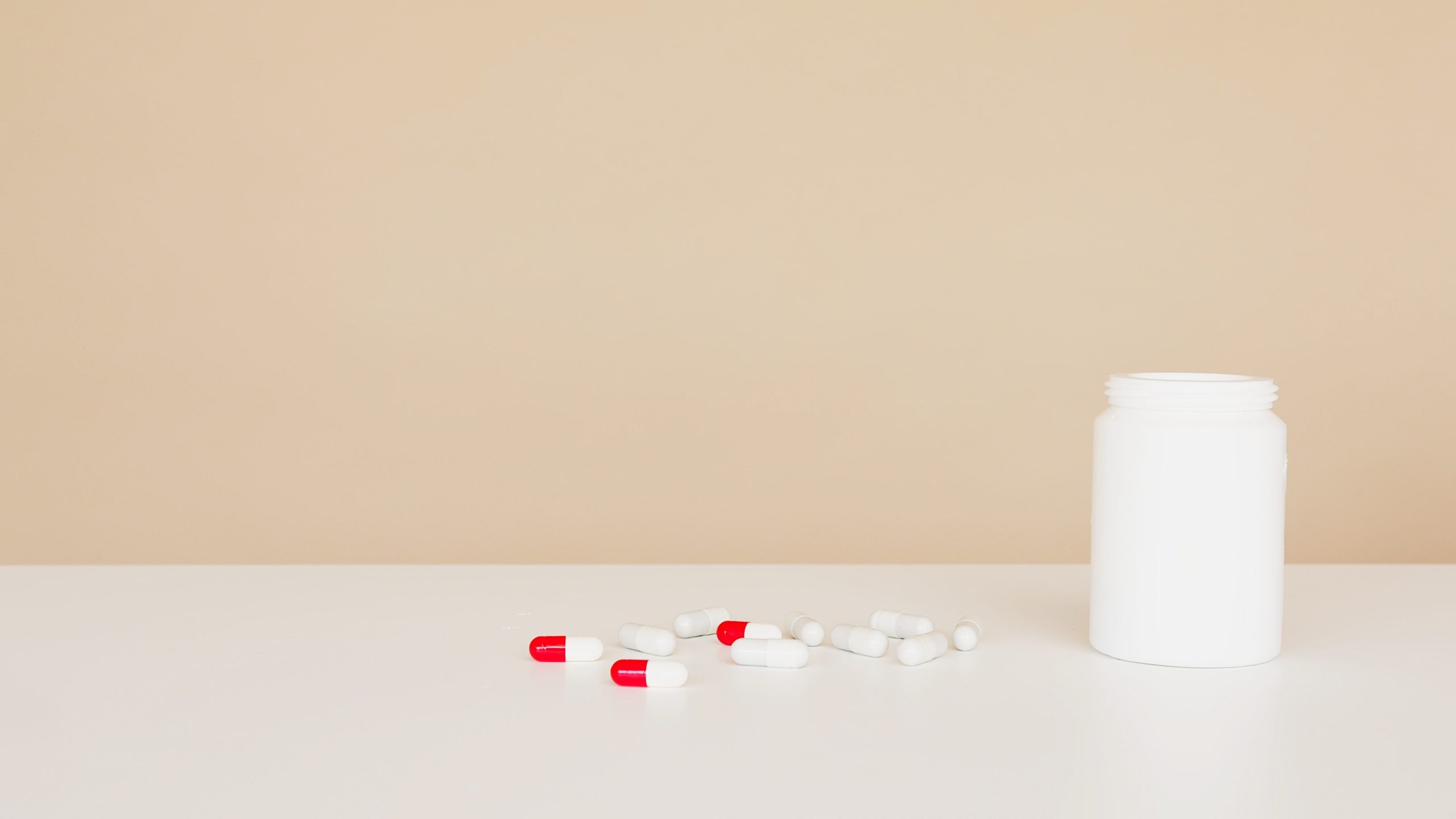 Bottle of antibiotics and pills sitting on counter