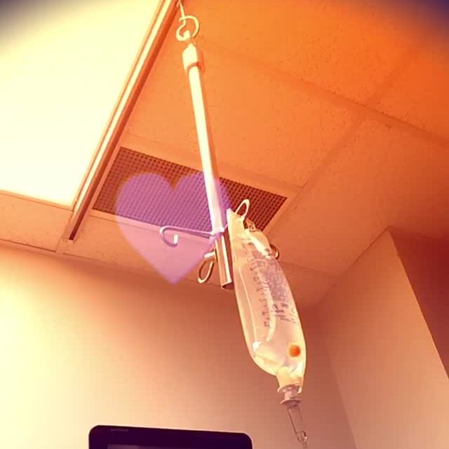 My saline bag connected to the IV pole at my liver biopsy