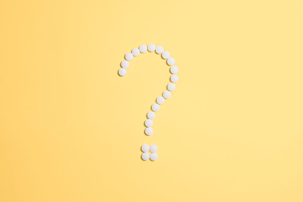 Question mark made of pills for FAQ