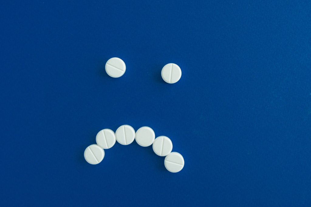 Pills forming a frowny face